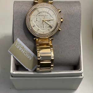 Ladies Michael Kors dress watch. Crystal stones surrounding face. New with tag.
